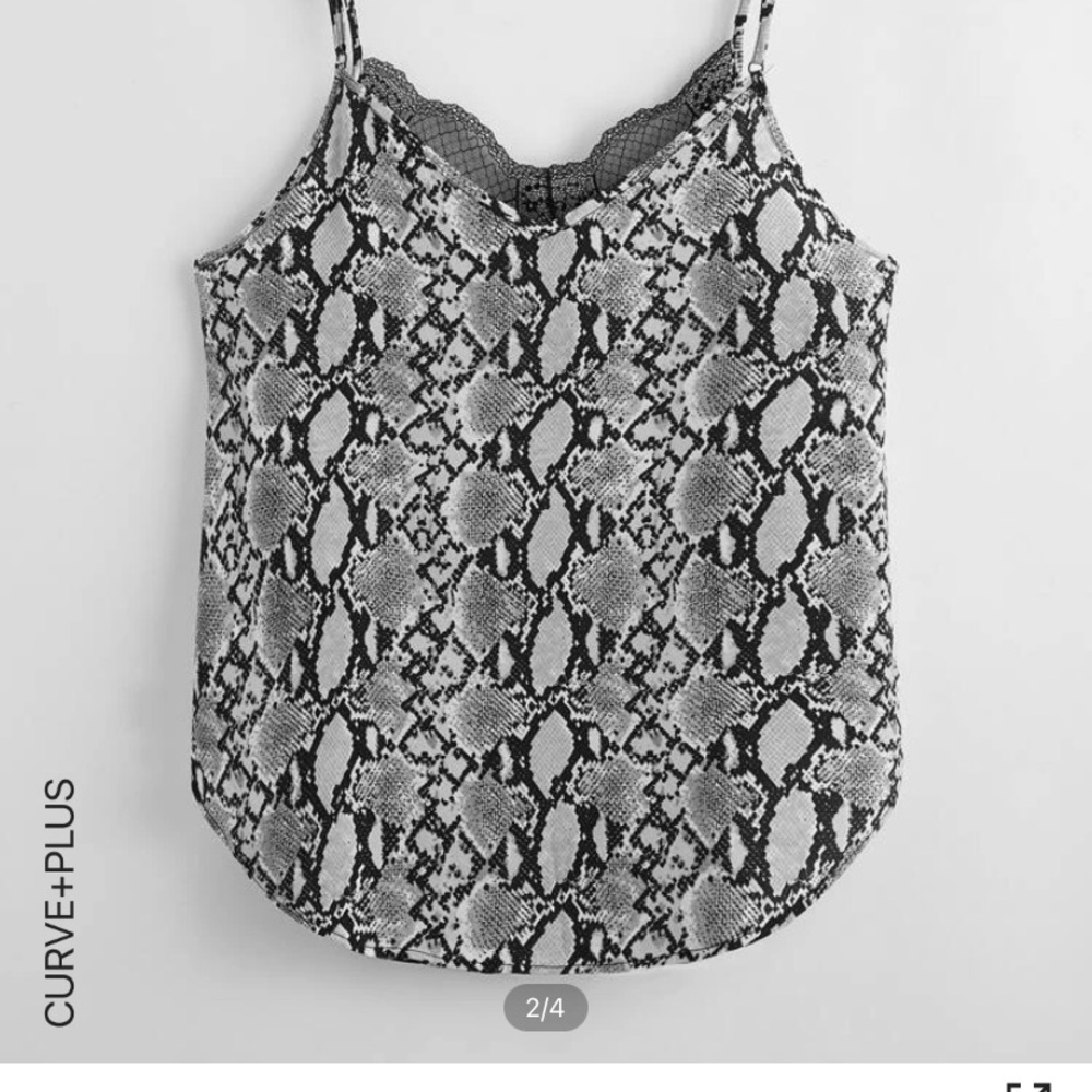 Sleeveless blouse with lace along neckline